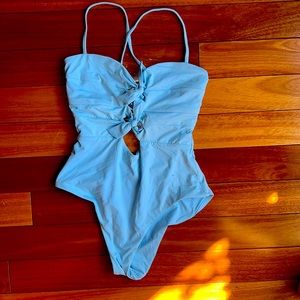 This is the cutest Beca one piece in size medium and light blue!!